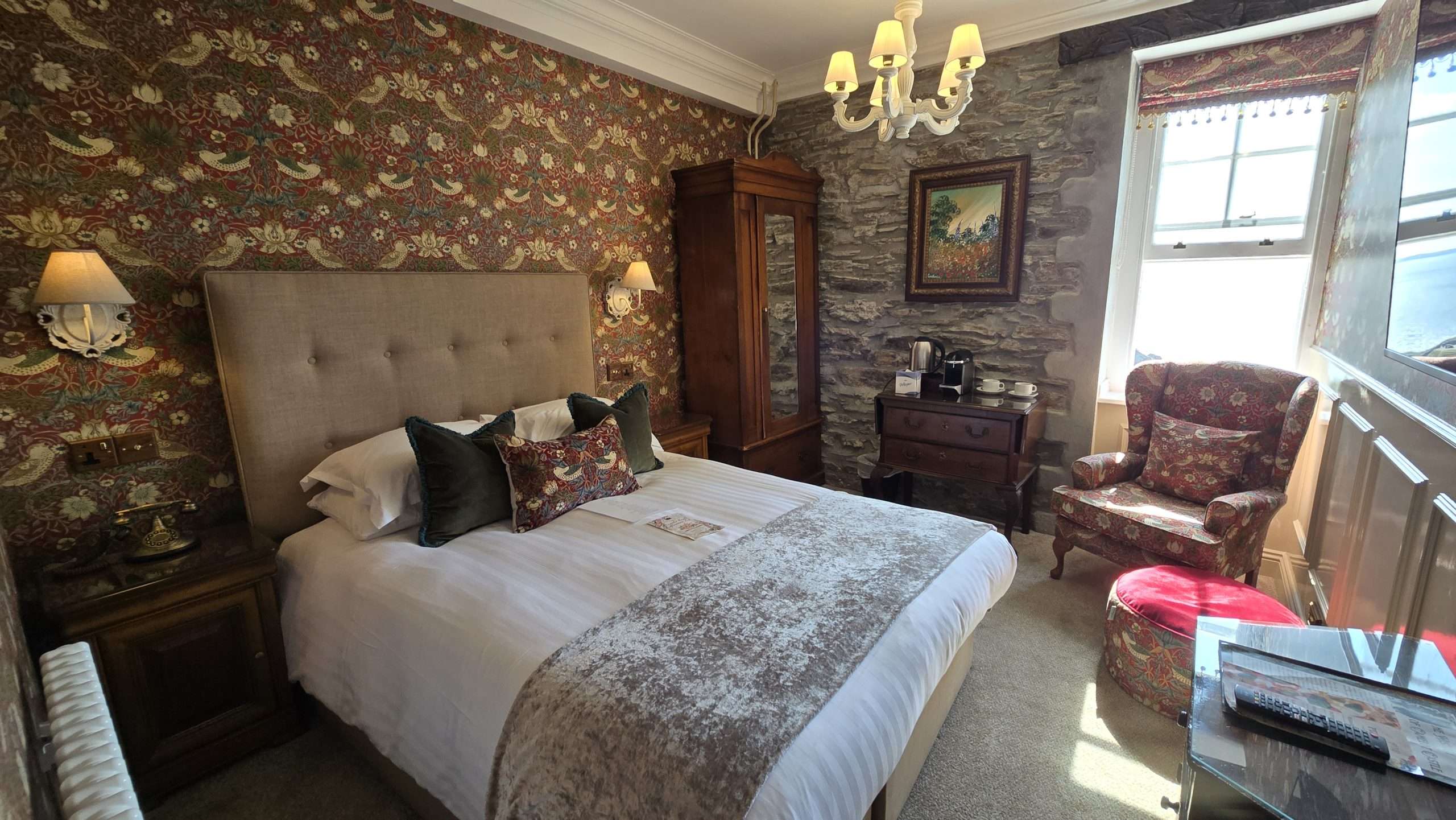 Luxury double room at Camelot Castle Hotel in Tintagel Cornwall with bed seating area and interior