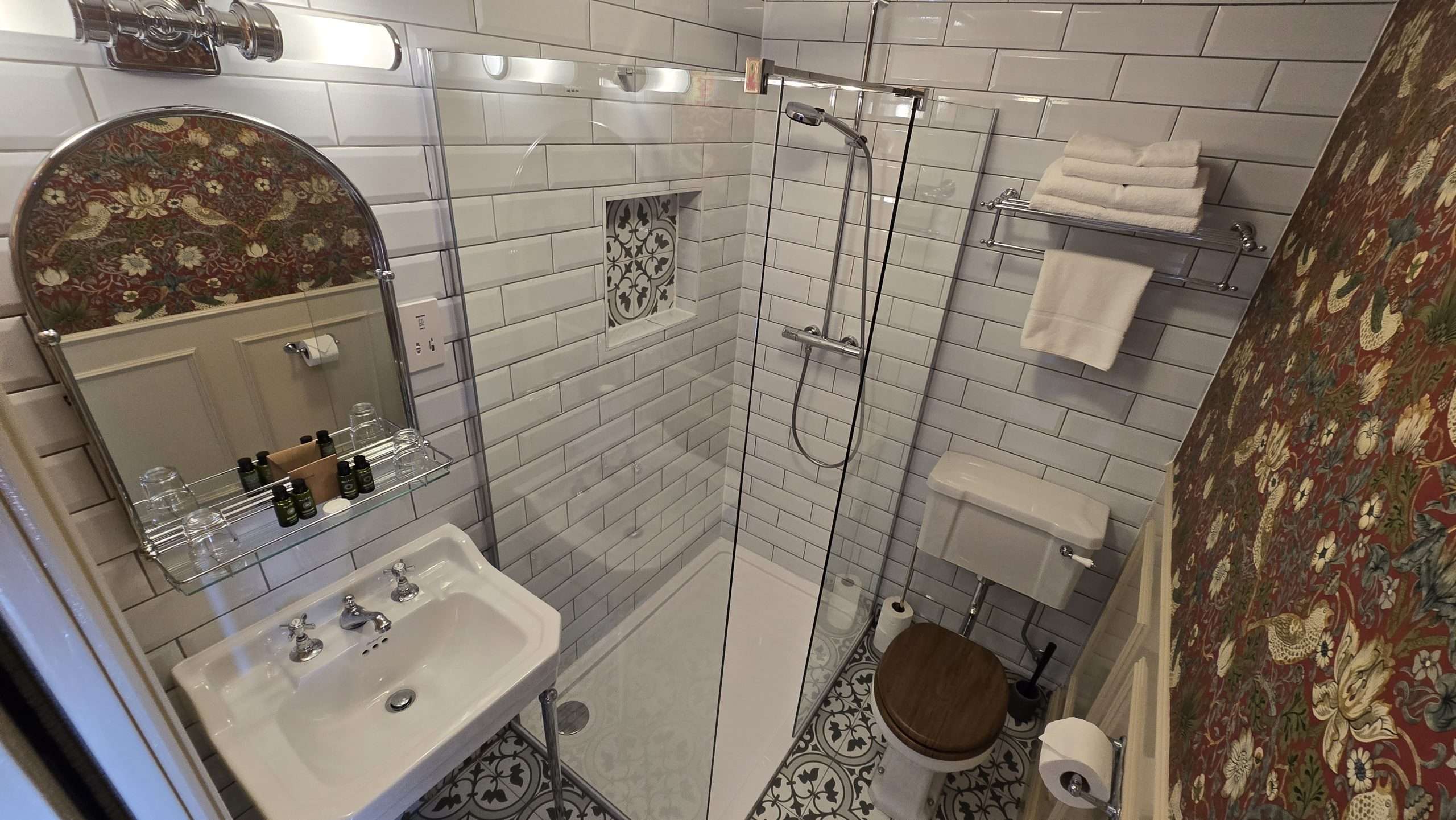 Walk in shower in the Deluxe Double Room bathroom at Camelot Castle Hotel