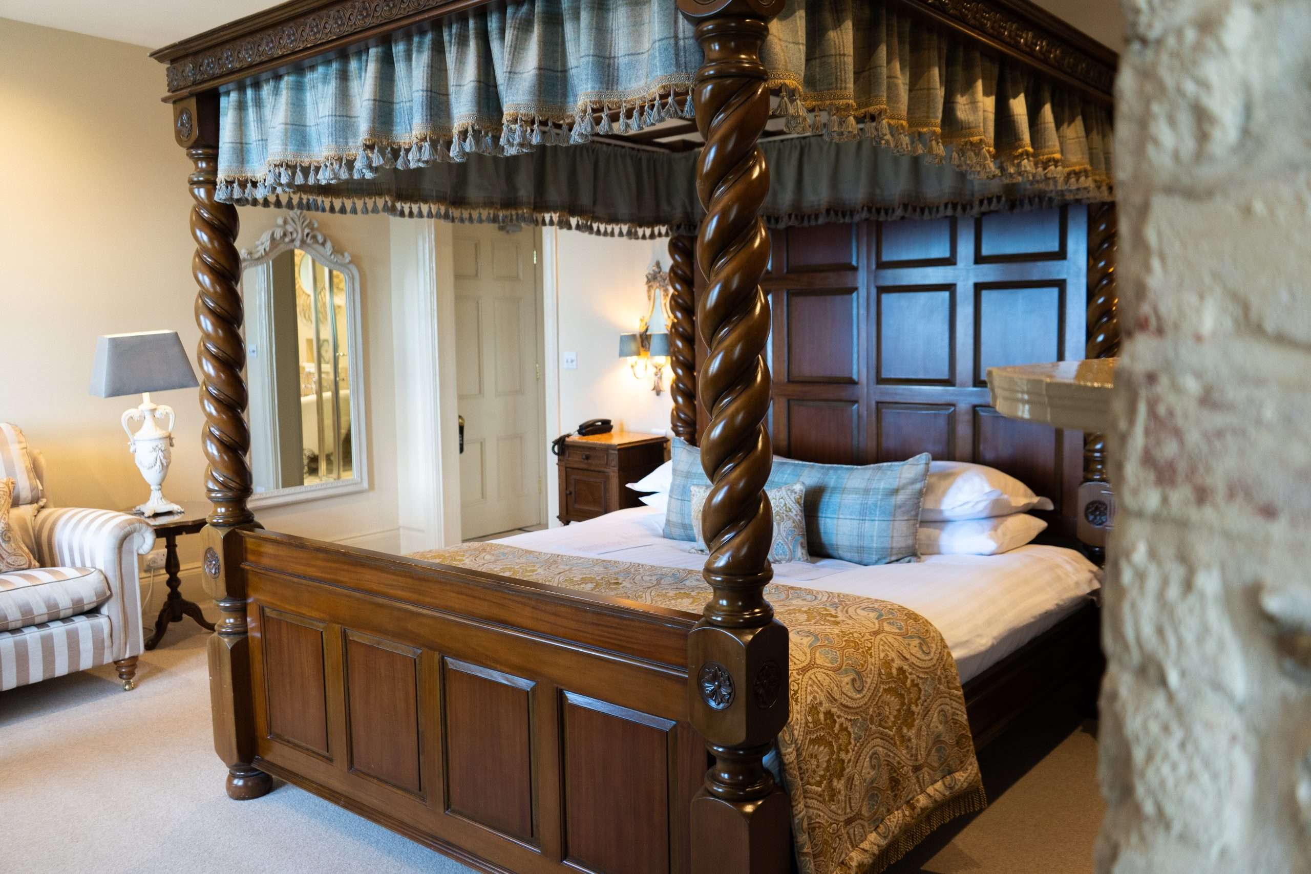 Four-poster bed in the South Tower Junior Suite at Camelot Castle Hotel