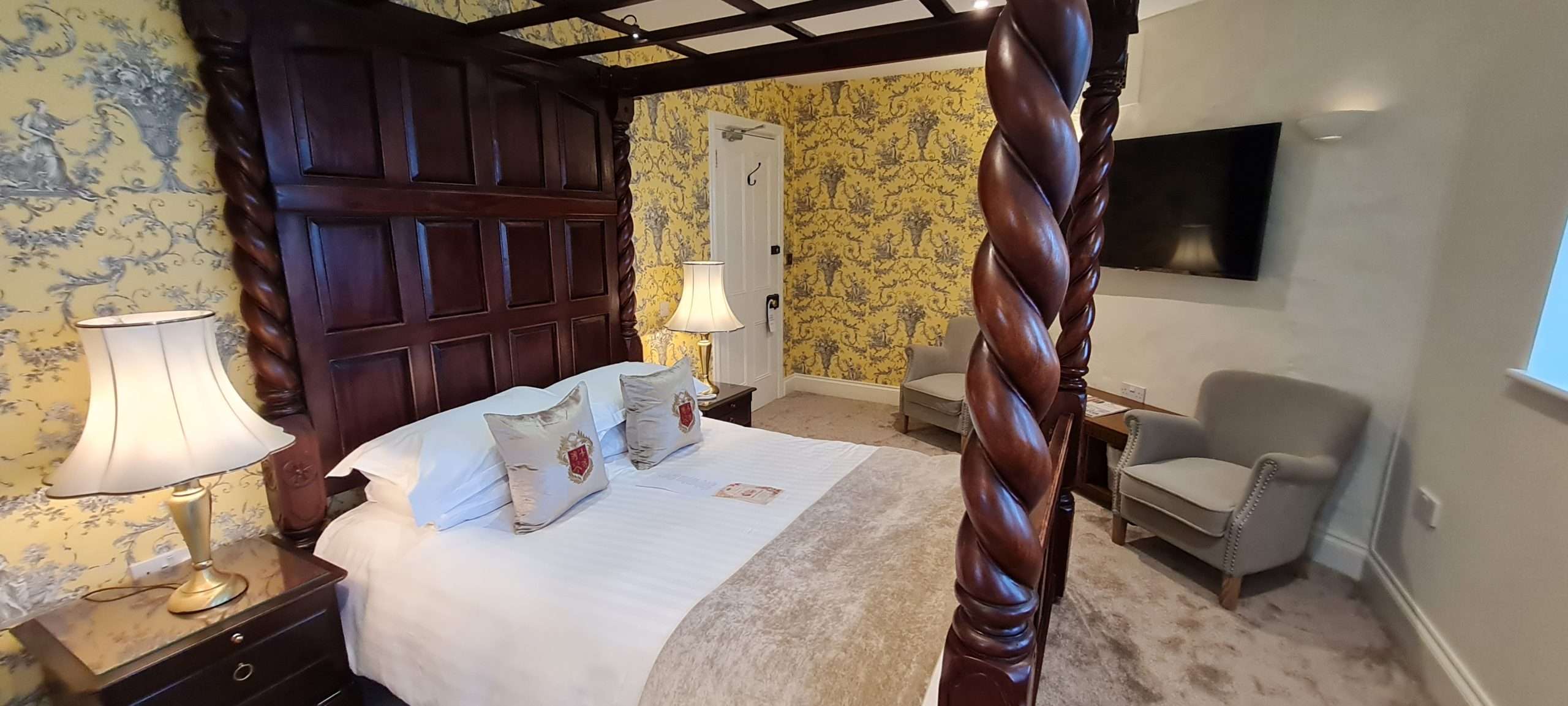 Deluxe Four Poster Room bedroom interior at Camelot Castle Hotel