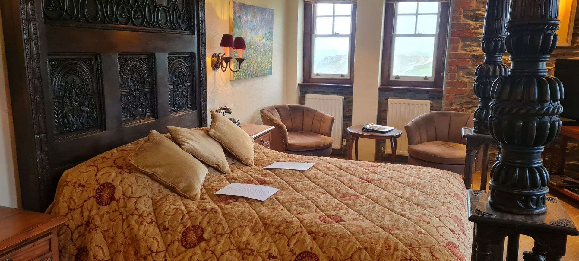 East Tower Junior Suite bedroom with sea views at Camelot Castle Hotel Tintagel