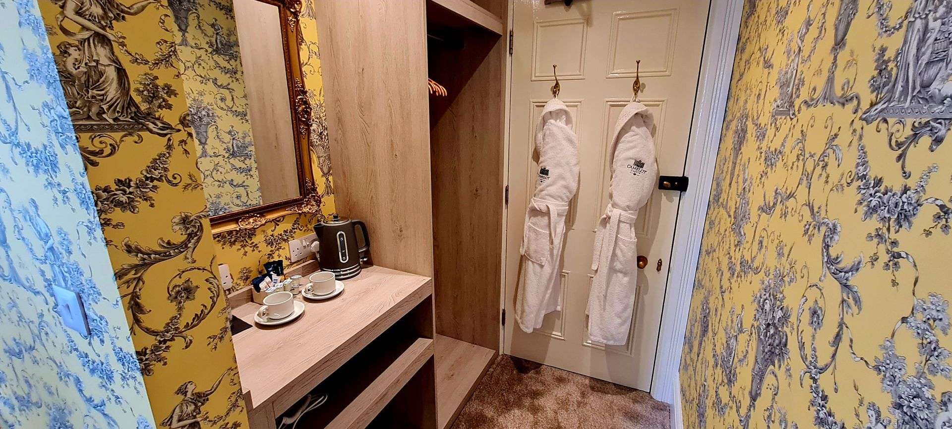 Dressing area with robes in the North Tower Suite