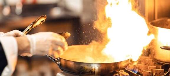 Chef cooking dinner at Irinas restaurant, Camelot Castle Hotel, Tintagel, Cornwall