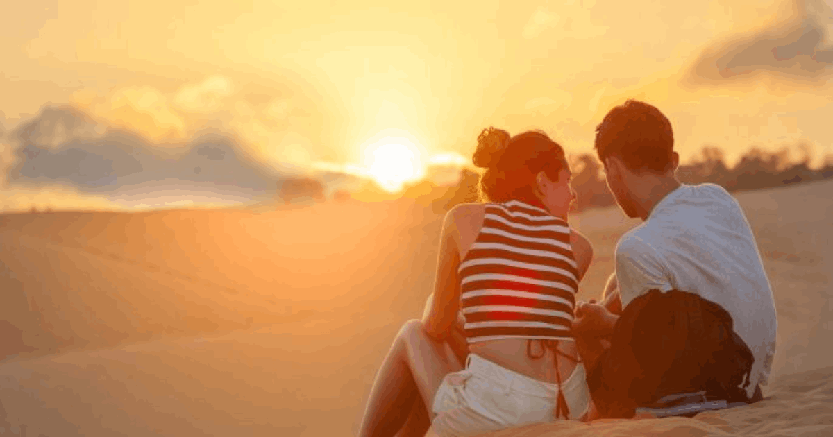 Couple enjoying a romantic escape near Camelot Castle Hotel in Tintagel Cornwall at sunset