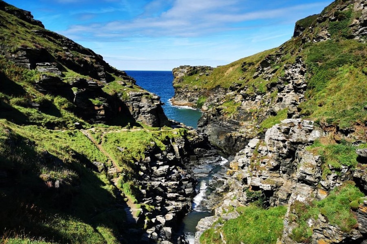 Rocky Valley coastal walk near Tintagel in North Cornwall with steep cliffs and rocky gorge